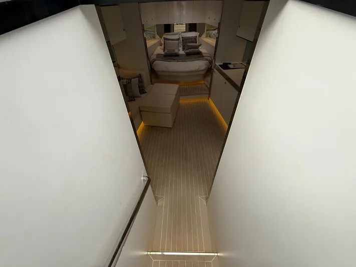  Yacht Photos Pics Luxurious interior of 2019 VanDutch 55 yacht, featuring elegant bedroom and modern design.