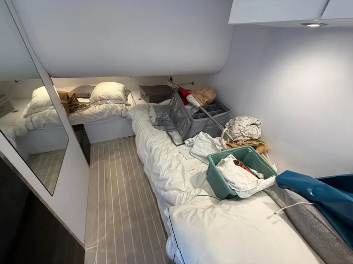  Yacht Photos Pics Interior cabin of 2019 VanDutch 55 yacht with bed and storage items.
