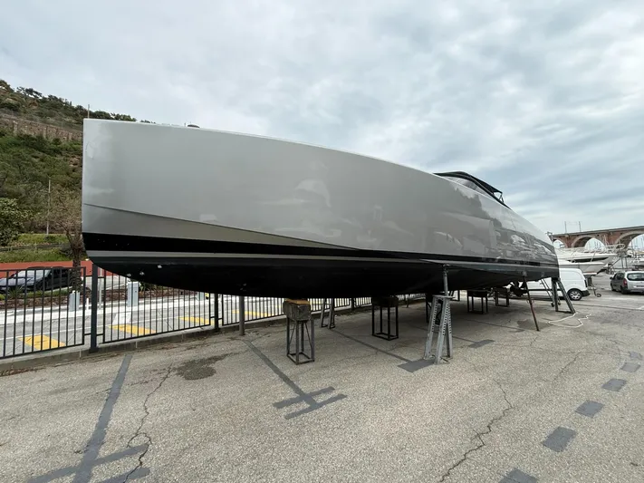 Yacht Photos Pics 2019 VanDutch 55 yacht on dry dock, sleek design, overcast sky.