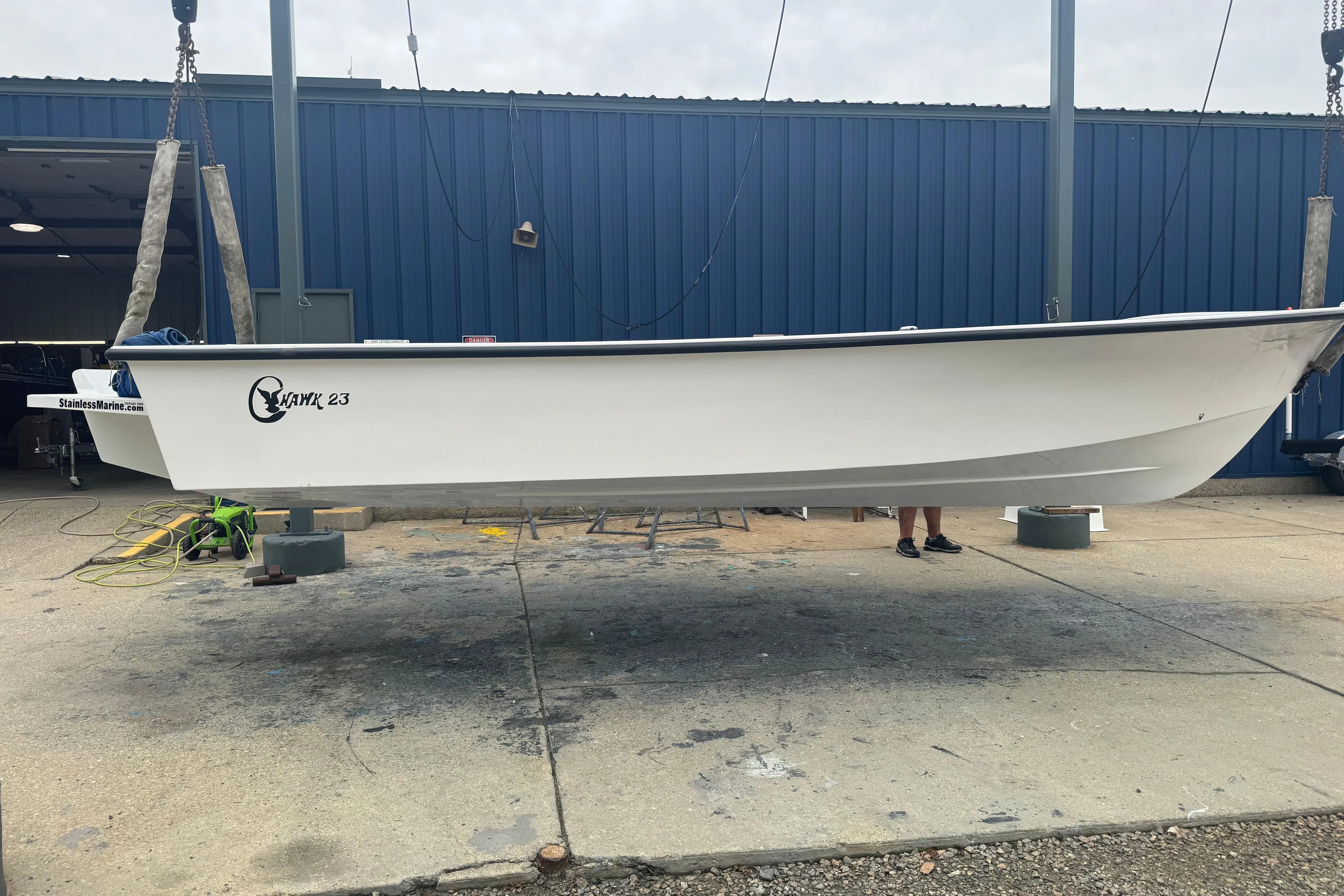 2026 C-Hawk 23 Center Console boat suspended at a marina.