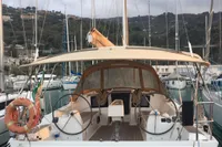 2015 Dufour 382 Grand Large sailboat docked in marina, rear view.