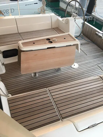  Yacht Photos Pics 2015 Dufour 382 Grand Large yacht cockpit with teak flooring and foldable table.