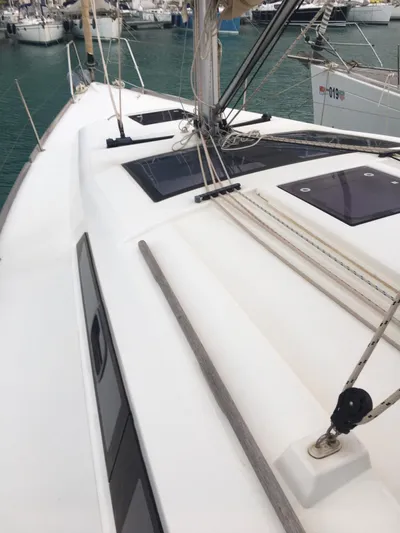  Yacht Photos Pics 2015 Dufour 382 Grand Large sailboat deck with rigging, docked in marina.