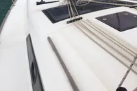 2015 Dufour 382 Grand Large sailboat deck with rigging, docked in marina.