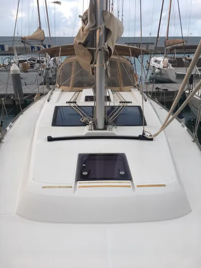  Yacht Photos Pics 2015 Dufour 382 Grand Large sailboat docked at marina, showcasing deck and mast.