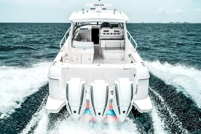  Yacht Photos Pics Manufacturer Provided Image: 2023 Intrepid 438 Evolution boat with triple outboard engines cruising on the ocean.