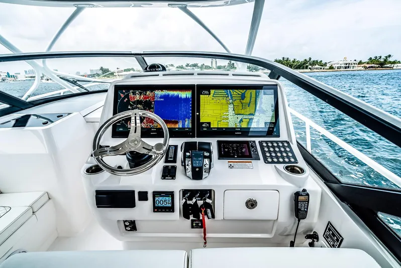  Yacht Photos Pics Manufacturer Provided Image: 2023 Intrepid 438 Evolution yacht helm with advanced navigation systems.