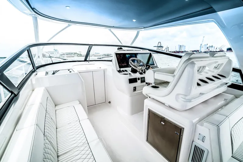  Yacht Photos Pics Manufacturer Provided Image: 2023 Intrepid 438 Evolution yacht cockpit with luxurious seating and modern helm.