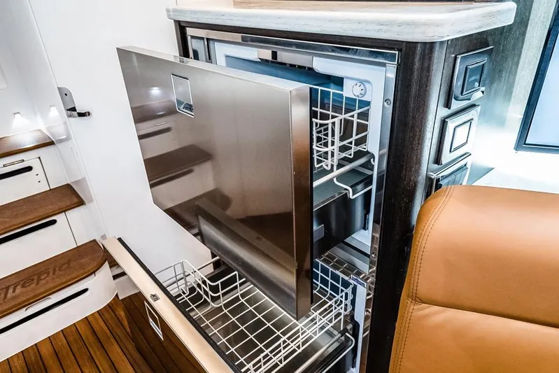  Yacht Photos Pics Manufacturer Provided Image: Intrepid 438 Evolution 2023 yacht interior with open stainless steel dishwasher.