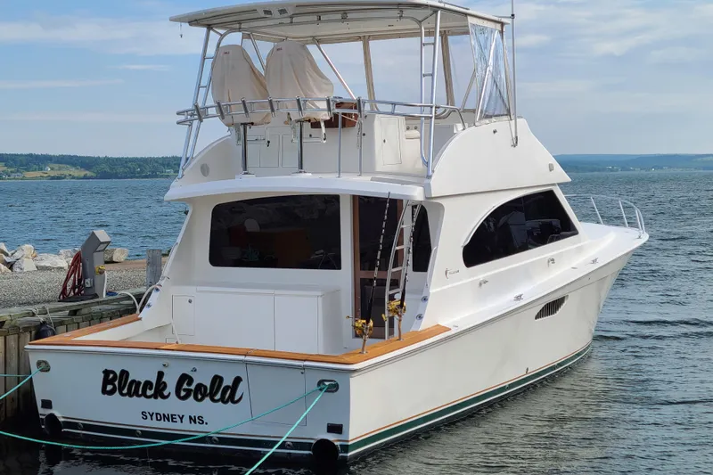 Black Gold Yacht Photos Pics 2006 Egg Harbor 50 Sport Yacht docked, named "Black Gold," in Sydney, NS.