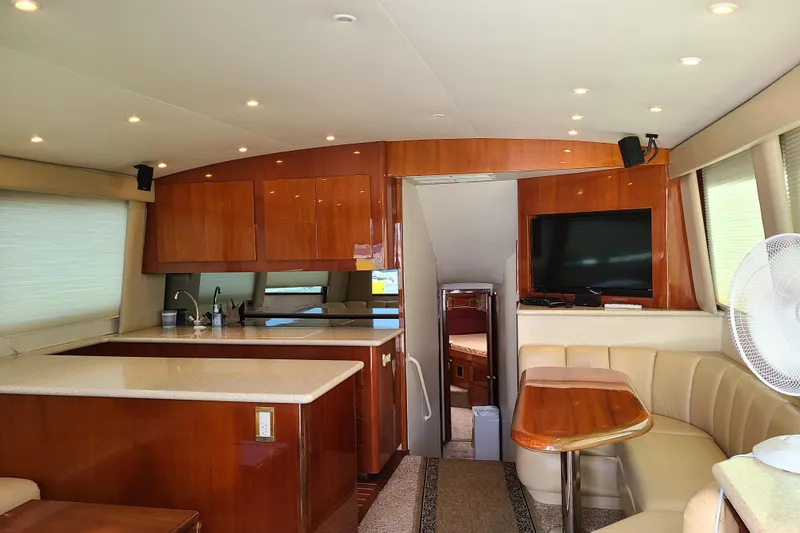 Black Gold Yacht Photos Pics Luxurious interior of 2006 Egg Harbor 50 Sport Yacht with modern kitchen and seating area.