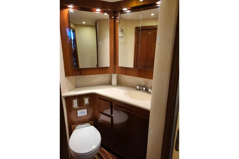 Black Gold Yacht Photos Pics Luxurious bathroom in 2006 Egg Harbor 50 Sport Yacht with elegant wood finishes.