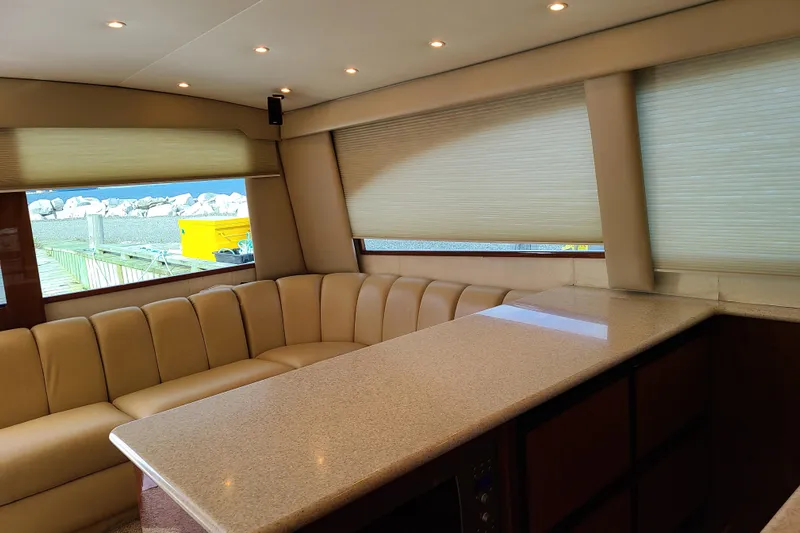 Black Gold Yacht Photos Pics Interior of 2006 Egg Harbor 50 Sport Yacht with beige seating and countertop.