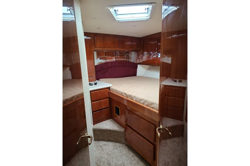Black Gold Yacht Photos Pics Luxurious cabin interior of 2006 Egg Harbor 50 Sport Yacht with wood finish.