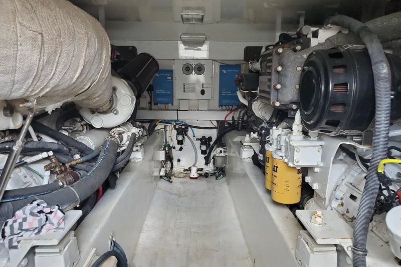 Black Gold Yacht Photos Pics Engine room of a 2006 Egg Harbor 50 Sport Yacht, showcasing mechanical components and systems.