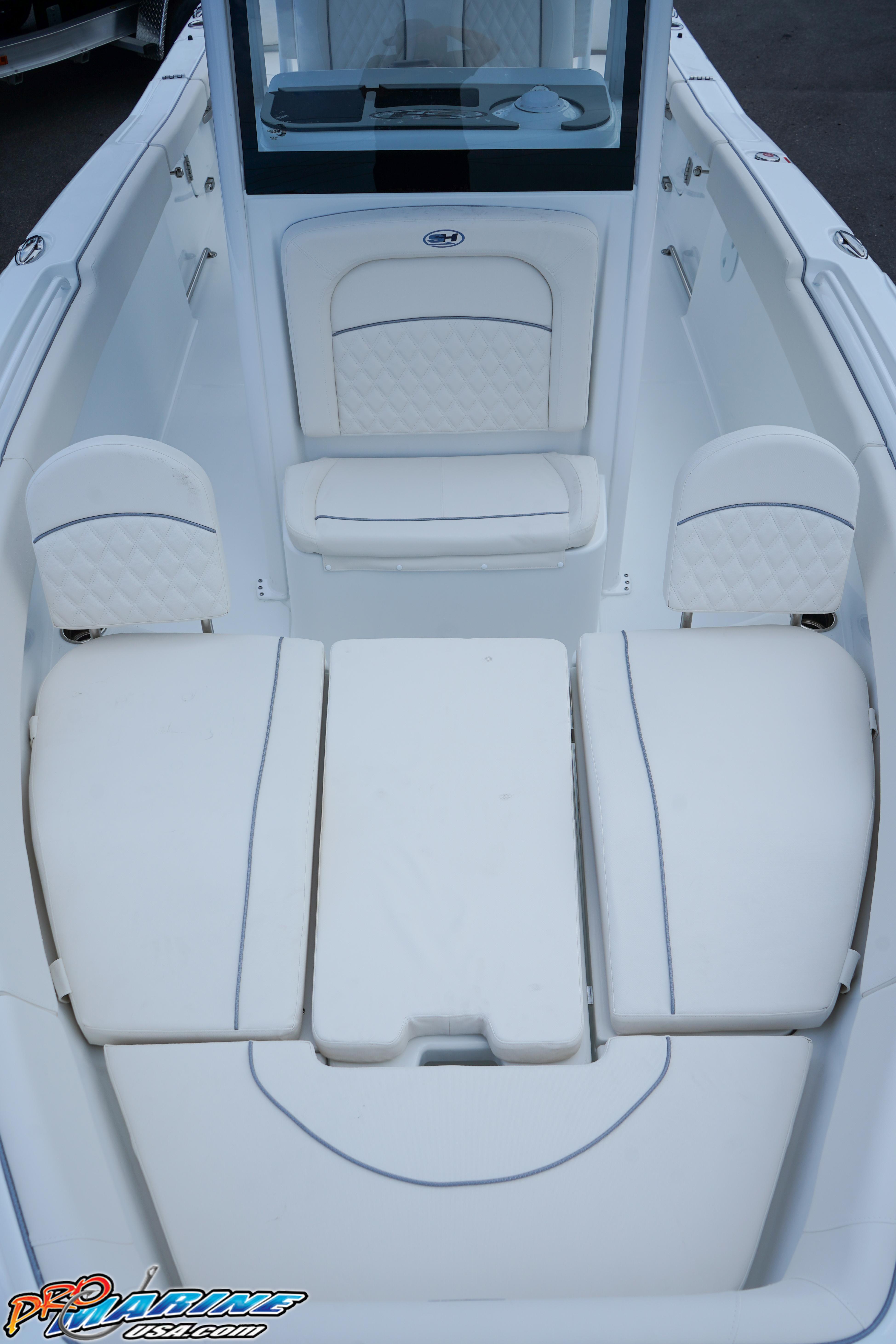 2026 Sea Hunt Ultra 255 SE boat interior with white cushioned seating.