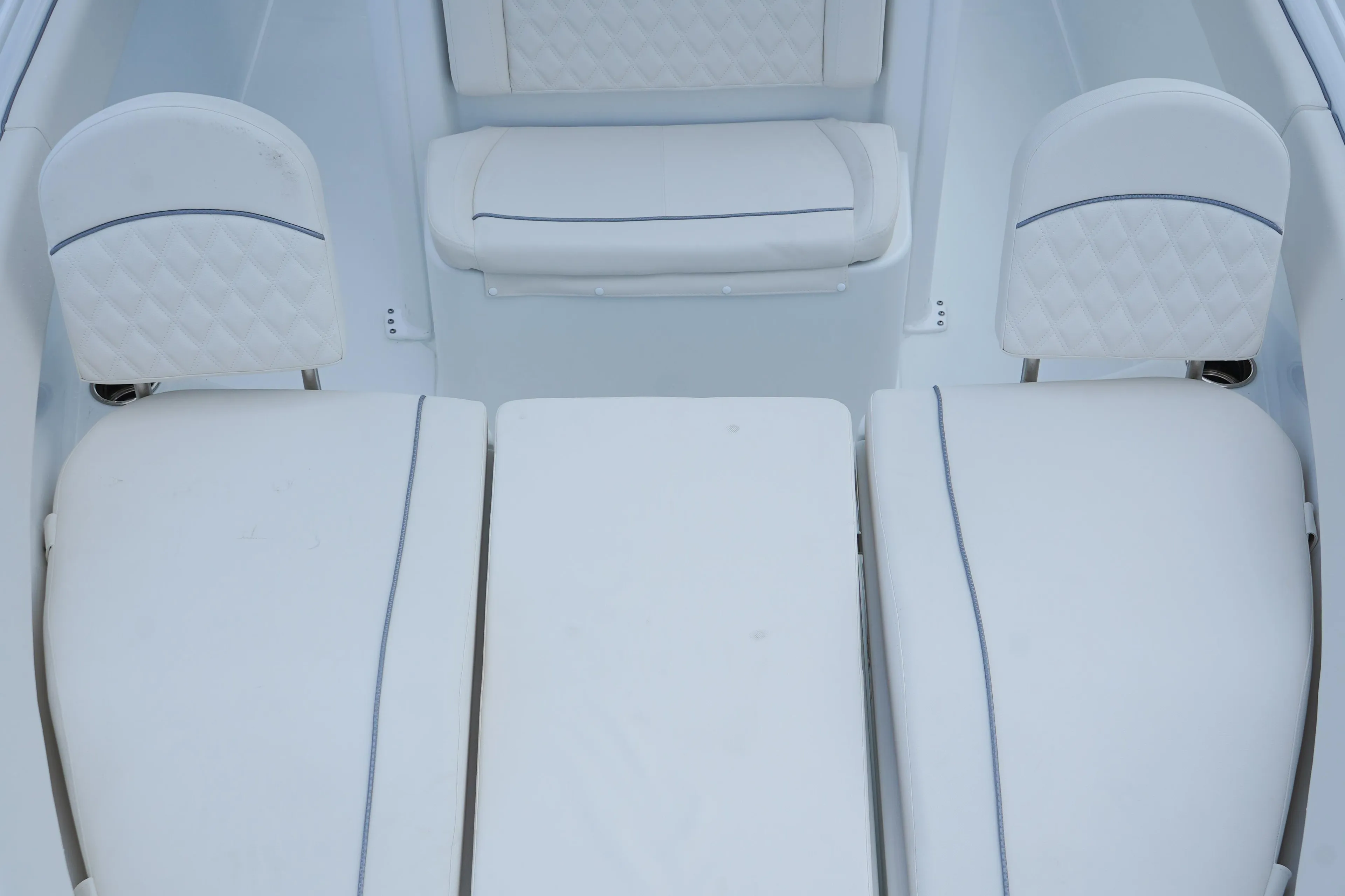 2026 Sea Hunt Ultra 255 SE boat interior with white cushioned seating.