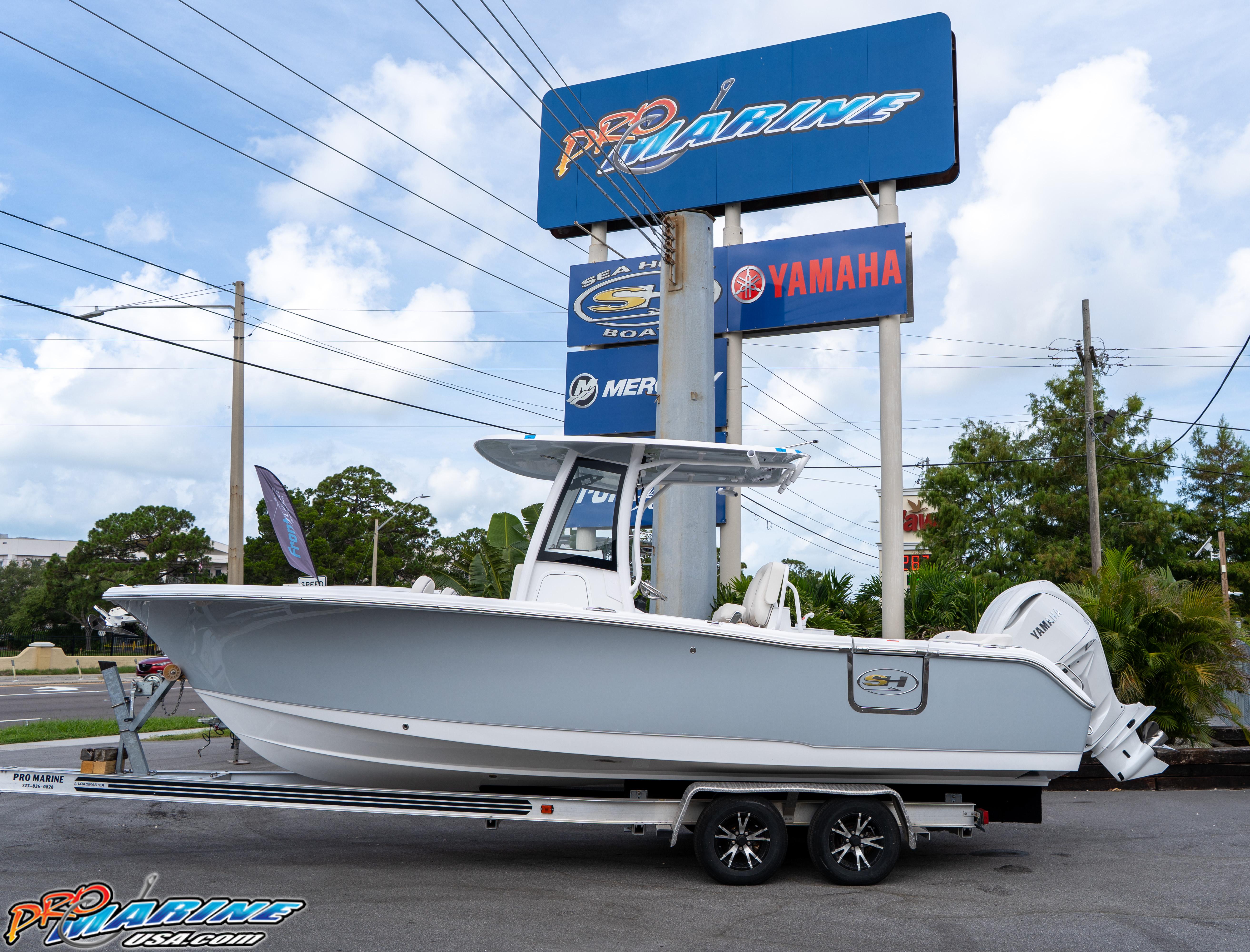 2026 Sea Hunt Ultra 255 SE boat on trailer at Pro Marine dealership.