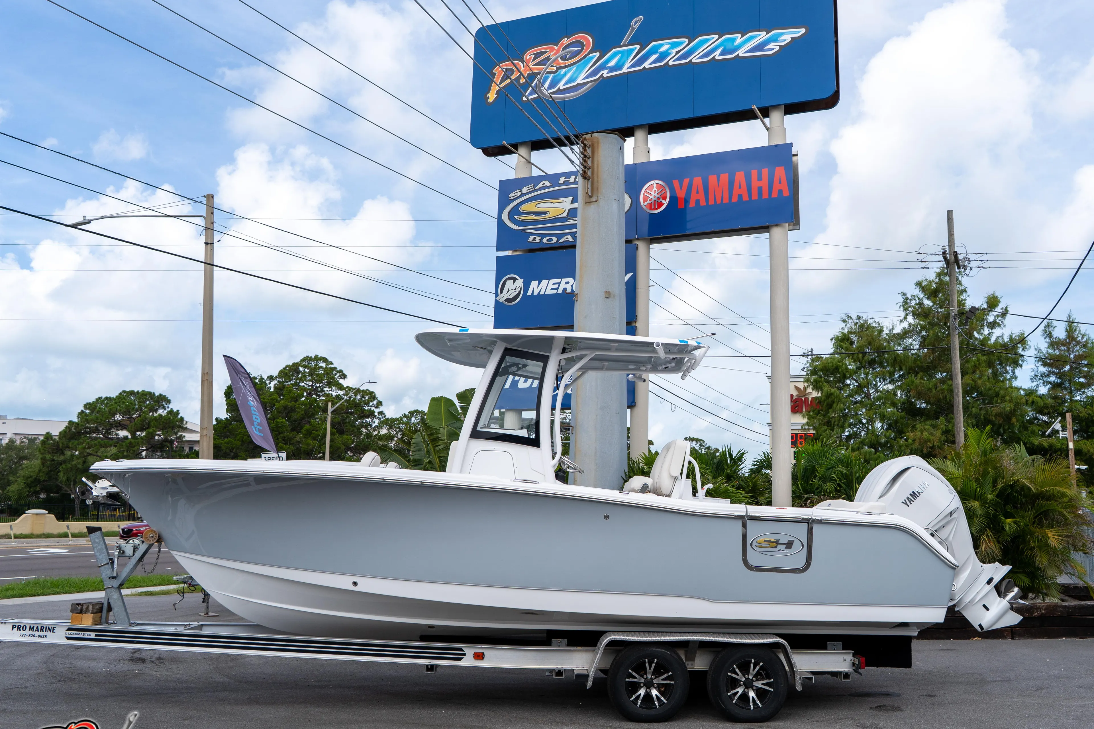 2026 Sea Hunt Ultra 255 SE boat on trailer at Pro Marine dealership.