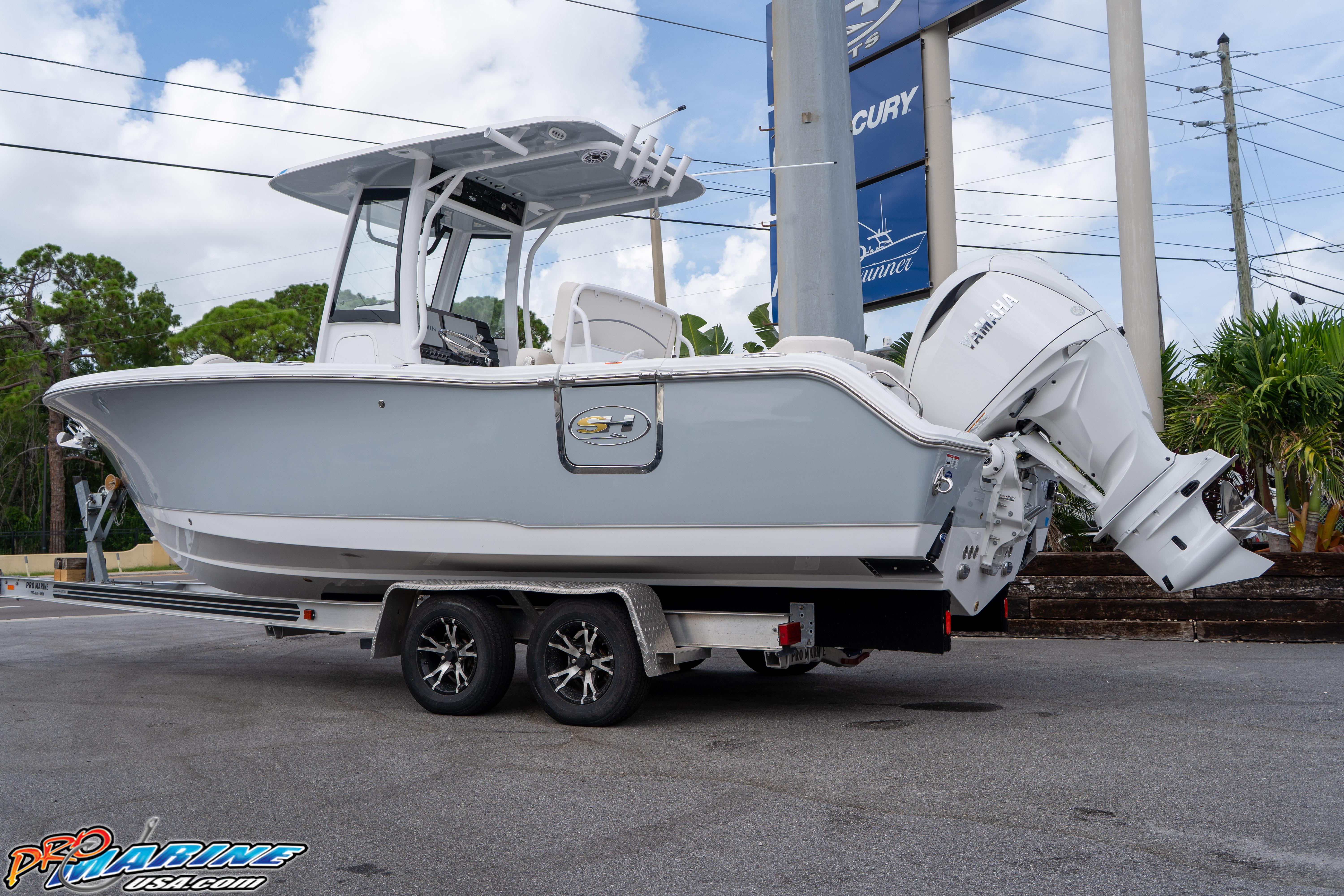 2026 Sea Hunt Ultra 255 SE boat on trailer, displayed outdoors.