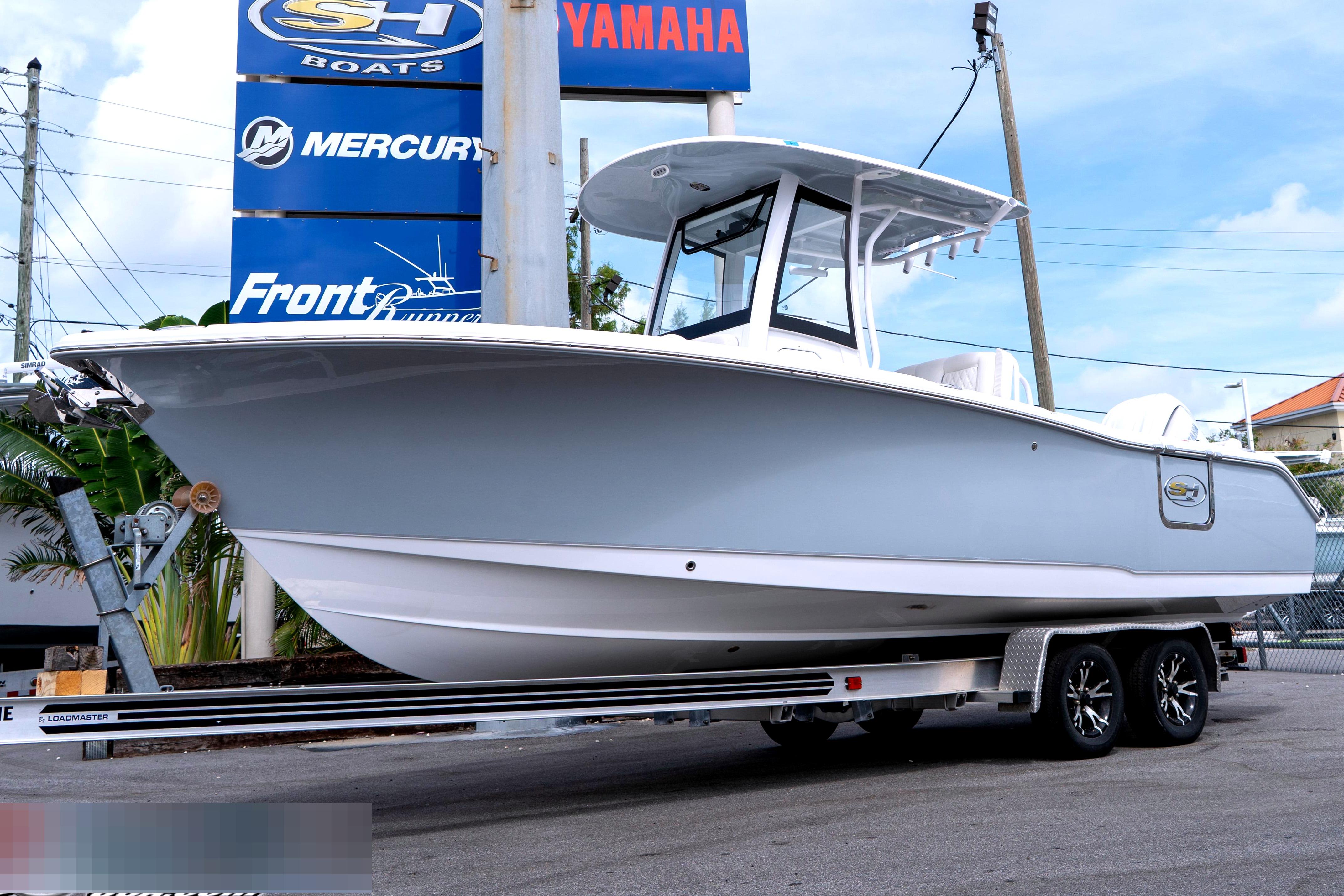 2026 Sea Hunt Ultra 255 SE boat on trailer at Pro Marine dealership.