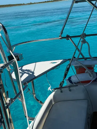  Yacht Photos Pics Catalina 470 sailboat on clear blue water, 2005 model, sunny day.