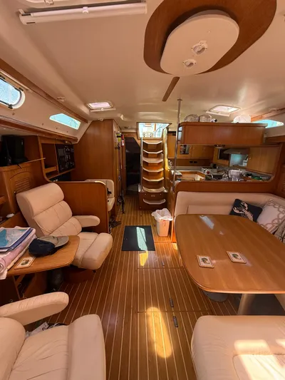  Yacht Photos Pics Interior of 2005 Catalina 470 yacht with wooden furnishings and cozy seating area.