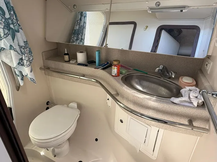  Yacht Photos Pics Bathroom interior of a 2005 Catalina 470 yacht with sink and toilet.