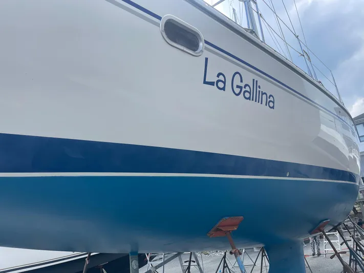  Yacht Photos Pics Catalina 470 sailboat named "La Gallina," 2005 model, docked on a stand.