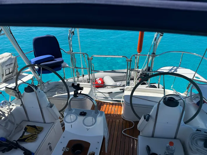  Yacht Photos Pics 2005 Catalina 470 yacht cockpit with dual steering wheels and clear blue water backdrop.