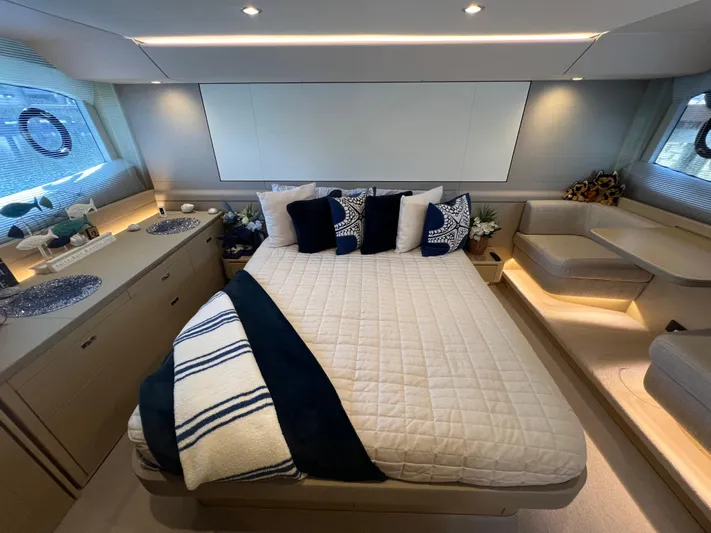 Balance Yacht Photos Pics Luxurious bedroom interior of 2018 Princess F55 yacht with elegant decor and cozy bedding.
