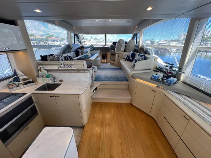 Balance Yacht Photos Pics Luxurious interior of 2018 Princess F55 yacht with modern furnishings and panoramic windows.