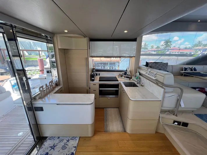 Balance Yacht Photos Pics Luxurious interior of 2018 Princess F55 yacht with modern kitchen and seating area.