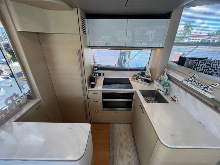 Balance Yacht Photos Pics Modern kitchen interior of 2018 Princess F55 yacht with sleek cabinetry and appliances.