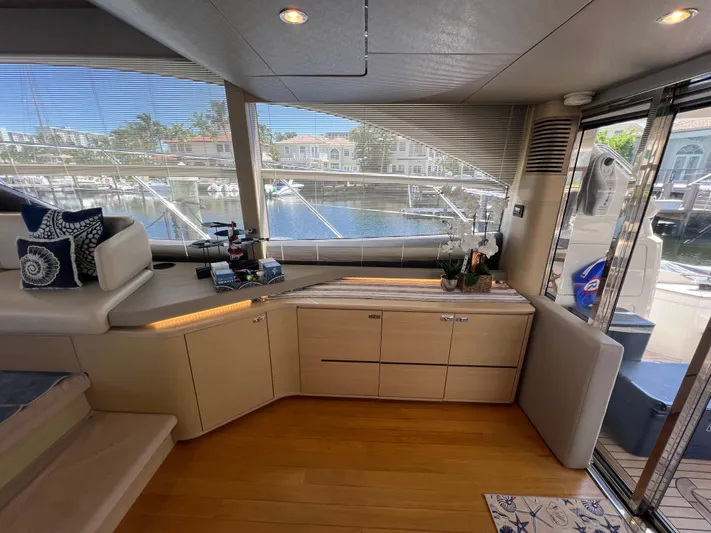 Balance Yacht Photos Pics Luxurious interior of 2018 Princess F55 yacht with modern furnishings and marina view.