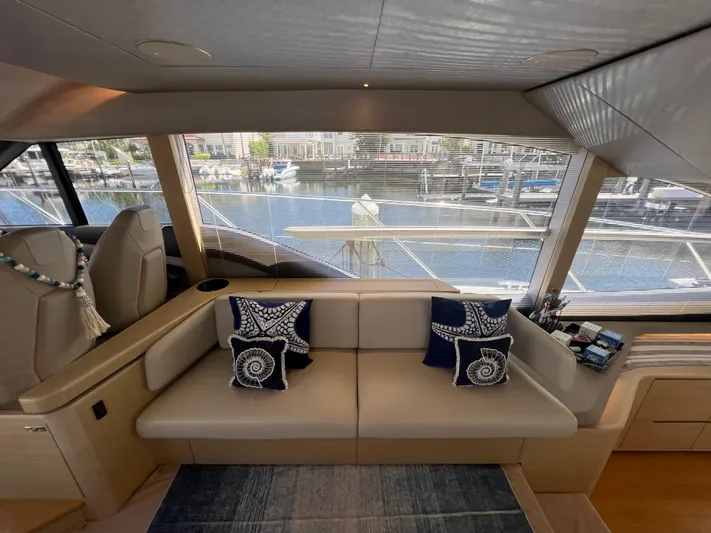 Balance Yacht Photos Pics Luxurious 2018 Princess F55 yacht interior with elegant seating and nautical-themed cushions.