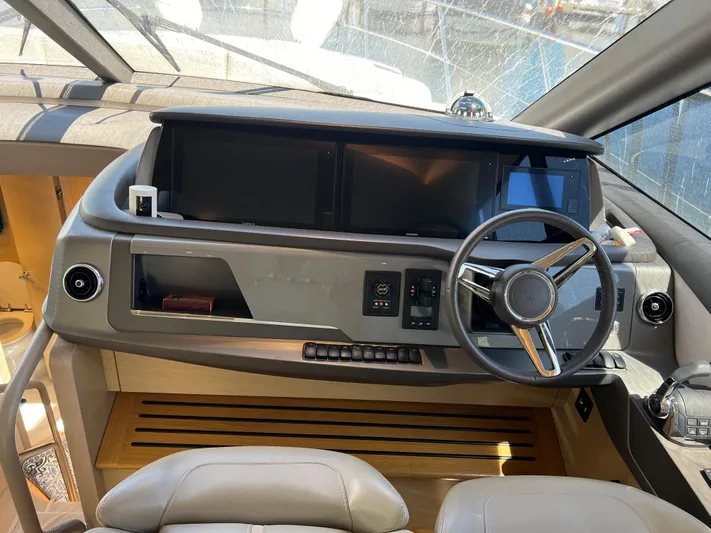 Balance Yacht Photos Pics Luxury yacht helm of 2018 Princess F55 with modern controls and steering wheel.