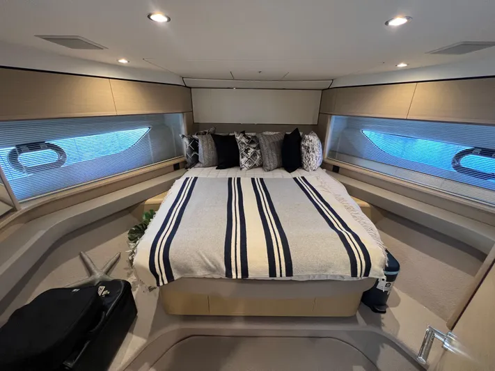 Balance Yacht Photos Pics Luxurious bedroom interior of 2018 Princess F55 yacht with modern decor and ambient lighting.