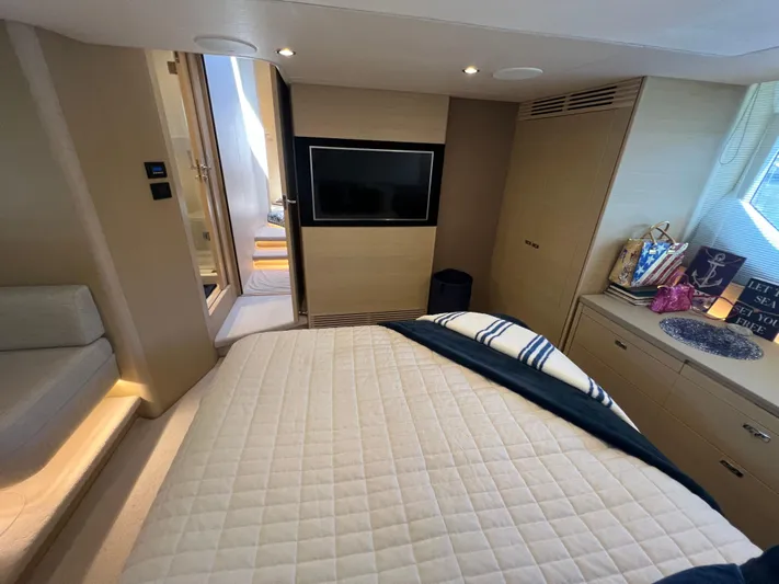 Balance Yacht Photos Pics Luxurious 2018 Princess F55 yacht bedroom with TV, modern decor, and natural lighting.