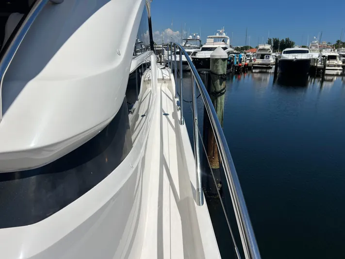Balance Yacht Photos Pics 2018 Princess F55 yacht docked at marina, clear blue sky, calm water.