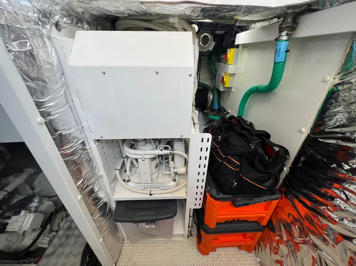 Balance Yacht Photos Pics Engine room of 2018 Princess F55 yacht with equipment and storage.