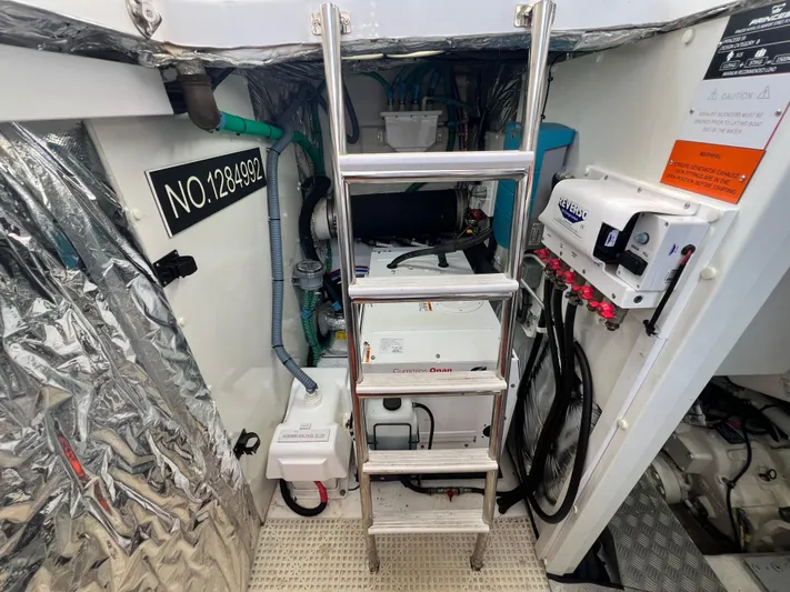 Balance Yacht Photos Pics Engine room of 2018 Princess F55 yacht with ladder and equipment.