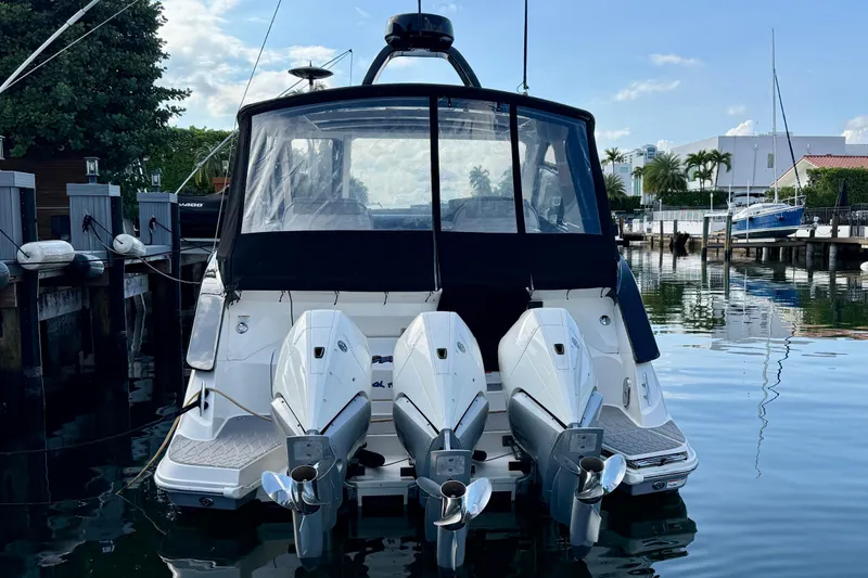  Yacht Photos Pics 2022 Sea Ray Sundancer 370 Outboard docked, showcasing triple outboard engines.
