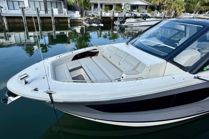  Yacht Photos Pics 2022 Sea Ray Sundancer 370 Outboard docked, showcasing sleek design and luxurious seating.