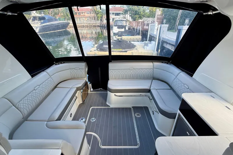 Yacht Photos Pics Luxurious interior of 2022 Sea Ray Sundancer 370 Outboard with elegant seating and waterfront view.