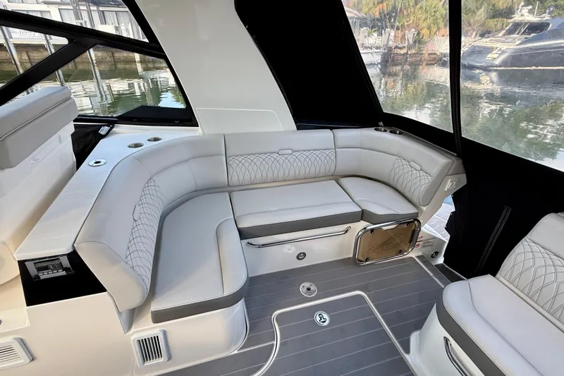 Yacht Photos Pics 2022 Sea Ray Sundancer 370 Outboard interior with elegant seating and modern design.