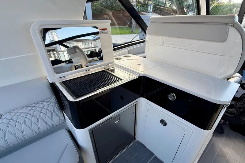  Yacht Photos Pics 2022 Sea Ray Sundancer 370 Outboard interior with sleek kitchenette and modern design.