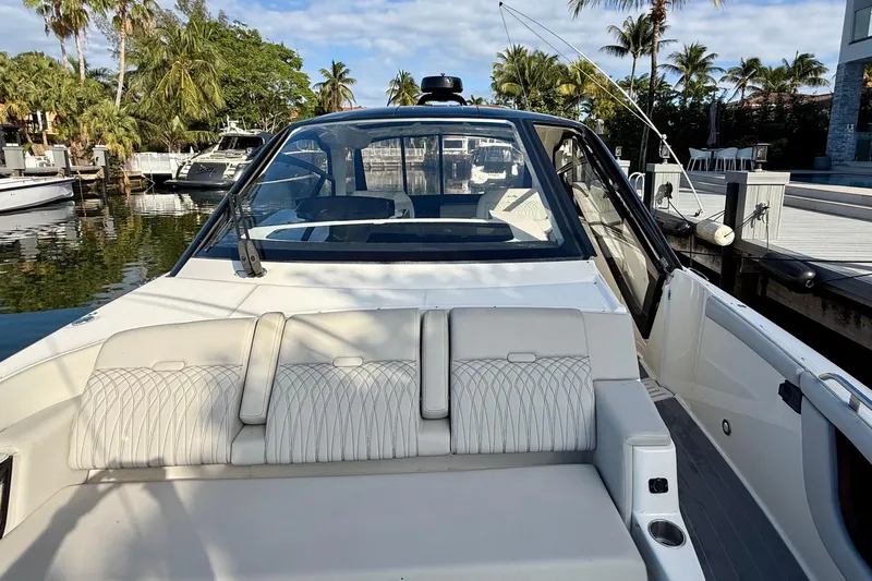 Yacht Photos Pics 2022 Sea Ray Sundancer 370 Outboard boat docked, featuring sleek design and comfortable seating.