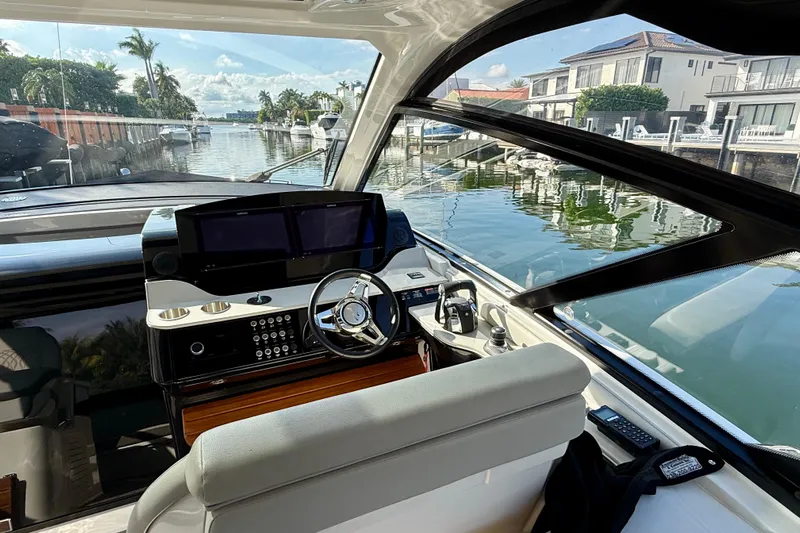  Yacht Photos Pics 2022 Sea Ray Sundancer 370 Outboard helm with dual screens, dockside view.