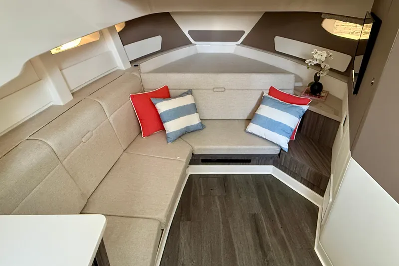  Yacht Photos Pics Luxurious interior of 2022 Sea Ray Sundancer 370 Outboard with cozy seating and decorative pillows.